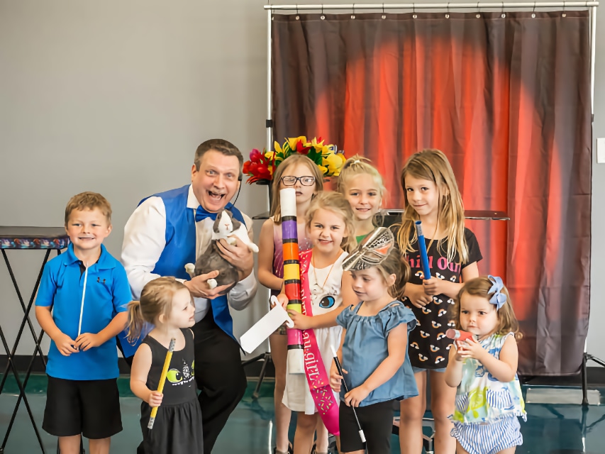 Nick Roberts performing with children