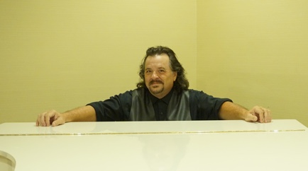 KnoxZimmer, founder of SES, sitting at a piano